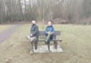 Volunteers try out the new benches at Hinchingbrooke Park
