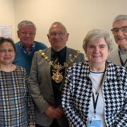 (L-R): Mike Baker - Chair of Board of Trustees, Mayor Cllr. Pearce, Anthony Clarke - Trustee, [front]Tripti Woolf - Huntingdon Office Manager, Michelle Panting - Volunteer Car Scheme Administrator