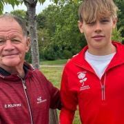 Former principal of Bushfield Academy in Peterborough, Eric Winstone, is also an English Athletics running coach and presented Liam with his new pair of running shoes.
