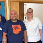 Nico Steenkamp has become the first knee replacement patient to go home on the same day as his surgery as part of a new service offered at Hinchingbrooke Hospital. He is pictured with the surgical team.