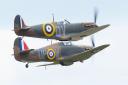 A Spitfire and Hurricane flying together at the IWM Duxford showcase day on Tuesday, August 4. Picture: Gerry Weatherhead