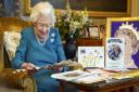 Queen Elizabeth II with memorabilia from her Golden and Platinum Jubilees at Windsor Castle