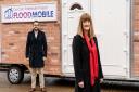 Ox-Cam Pathfinder Project\'s PFR business advisor, Matt Tandy, and residential advisor, Mary Dhonau OBE outside the Floodmobile.