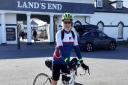 Keith Prendergast, of Eaton Socon, at Land\'s End in Cornwall before his charity cycle to John O\'Groats in Scotland.