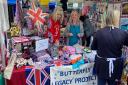 Butterfly Legacy Project volunteers selling Jubilee themed goods from their stall at St Ives market.