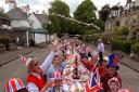 Residents of Murrayfield Drive in Edinburgh, sitting down to a previous Jubilee street party. Street parties in Huntingdonshire will start from today.