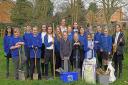 The Eco Explorers Club from Westfield Junior School, St Ives, planting native apple trees.