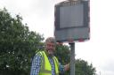 Cllr Philip Rayner with the speed monitor