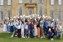Kimbolton students celebrate their A Level results as a group outside the castle.