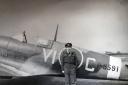Victor standing by a Spitfire that, by chance, has Squadron codes that spell out \'VIC\'.
