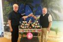 Peter Andrews (left) toasts his 50-year partnership with chairman and fellow co-owner Renford Sargent.