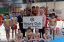 Huntingdon Gym Club youngsters with members of Huntingdon Rotary club.