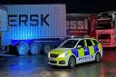 Police at the scene of the lorry break-ins at Cambridge services last night.