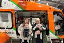 Molly and her mum Jan with the twins on a visit to the Magpas headquarters.