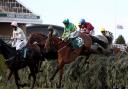 Tom Cannon and Talkischeap (far right) follow eventual winner Minella Times, ridden by Rachael Blackmore, in the Grand National.