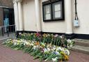 Flowers have been laid outside Huntingdon Town Hall.