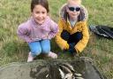Esme Bartlett, 5, and her friend James Ford, 6, with a successful haul of fish from their whip fishing venture