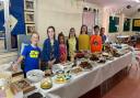 (From left to right) Louis, Elysia, Florence, Sophia, Libby, John, & Emily at the Buckden cake sale
