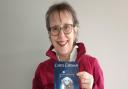 Carol Carman pictured with her new book Twicetime, published by McCaw Press.