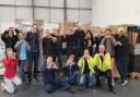 Volunteers and workers with the donations they helped to package at a collection centre in Huntingdonshire.