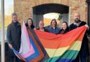 St Neots mayor, Cllr Stephen Ferguson (right) and other councillors help to raise the Progressive Pride flag.