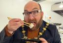 Mayor of Huntingdon, Cllr David Landon Cole tucks into some sushi at the Doge Sushi opening.