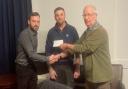 Revamp the Ramp chairman Chris Hatch and director Sam Curtin received a £2,000 cheque from Rotary Club president Mike Kingdon.