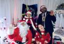 Lilly having fun at the Santa party with Mayor of Huntingdon, Cllr David Landon Cole and Mr and Mrs Claus.
