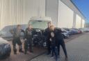 The team at AG Motors with the vandalised van at their repair shop in Cambridgeshire.