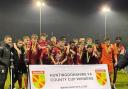 St Neots Town under-18s celebrate winning the Huntingdonshire County Youth Cup for a fourth time in five years.