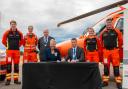 Magpas Air Ambulance signs the Armed Forces Covenant, alongside armed forces personnel and the Lord Lieutenant of Cambridgeshire, Julie Spence OBE.