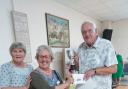 Diane Briars presented the joint winners cup toto Francisca  Shaw and Peter Walker.