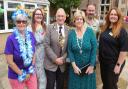 The Manor staff and Notcutts’ horticulturalists join Cllr Phillip Pearce, Mayor of Huntingdon, in officially unveiling their garden renovation project for care home residents to enjoy.