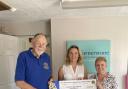 Bernard Dable presenting the cheque to Georgina Forbes and Hilary Thomson (centre) of Cornerstone Care in Confidence.