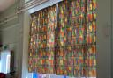 The curtains in the Priory Infant School hall are from the 1980s.