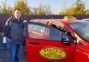 Stephen Woodham with one of his taxis