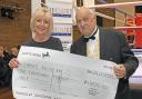 Christine Taylor (Mick Taylor's widow) and Geoff Richardson celebrated the donation to the Campol Boxing Club.