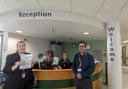Taite Tomlinson, Patient Experience Manager, and Alex Papp, Linguistic and Interpretation Service Coordinator pictured with outpatients team at Peterborough City Hospital.