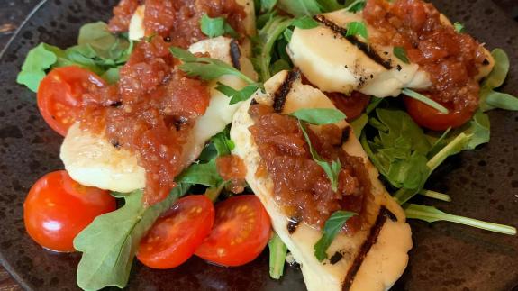 The Hunts Post: The grilled halloumi with herb marinated cherry tomatoes and salsa at The River Bar in Cambridge. The Hunts Post: The grilled halloumi with herb marinated cherry tomatoes and salsa at The River Bar in Cambridge.