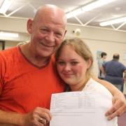 A father and daughter celebrate GCSE results day at Ernulf Academy