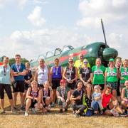 A selection of the 36 male and 30 female runners who participated in the 10k run alongside a Yak-52 aircraft