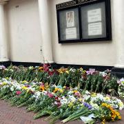 Flowers have been laid outside Huntingdon Town Hall.