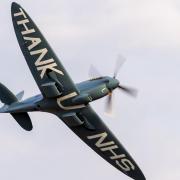 A solo display from the 'NHS Spitfire', painted with a message of thanks on the underside of its wings and the names of those who donated to NHS Charities Together.