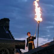 Major General Nick Eeles lights the beacon at Edinburgh Castle Credit for the Diamond Jubilee in 2012.