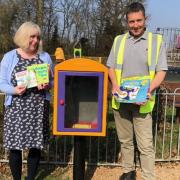 Little Paxton Parish Clerk Jenny Gellatly and Council Groundsman Mr Giles Buchanan with a revamped book swap box.