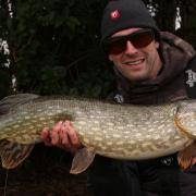 Mickey Bartlett of St Ives Tackle Shop with a 13lb Pike.