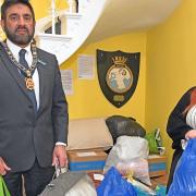 The Mayor of St Ives, Pasco Hussain, and Emma Egginton with donated items collected at the St Ives Town Hall for Ukraine.
