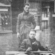 Mr Chalkley and Peter Hill pictured during the 1947 floods.