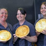 The award-winning butchers plan to sell unbaked pies to tackle the rising electricity bill. Pictured: staff at Measures Butchers celebrate the Great Taste awards in 2021.