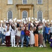Kimbolton students celebrate their A Level results as a group outside the castle.